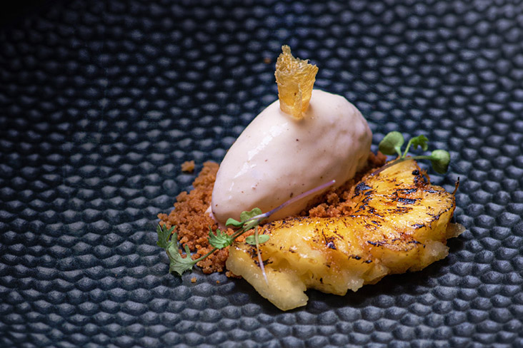 Grilled pineapple with chilli soy sauce, coconut ice cream and salted duck egg crumble.