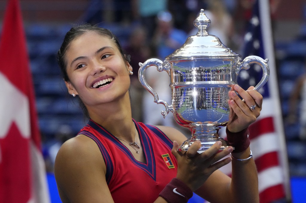 Britainu00e2u20acu2122s Emma Raducanu celebrates with the trophy after winning the 2021 US Open Tennis tournament womenu00e2u20acu2122s final match against Canadau00e2u20acu2122s Leylah Fernandez, in New York, on September 11, 2021. u00e2u20acu201d AFP pic