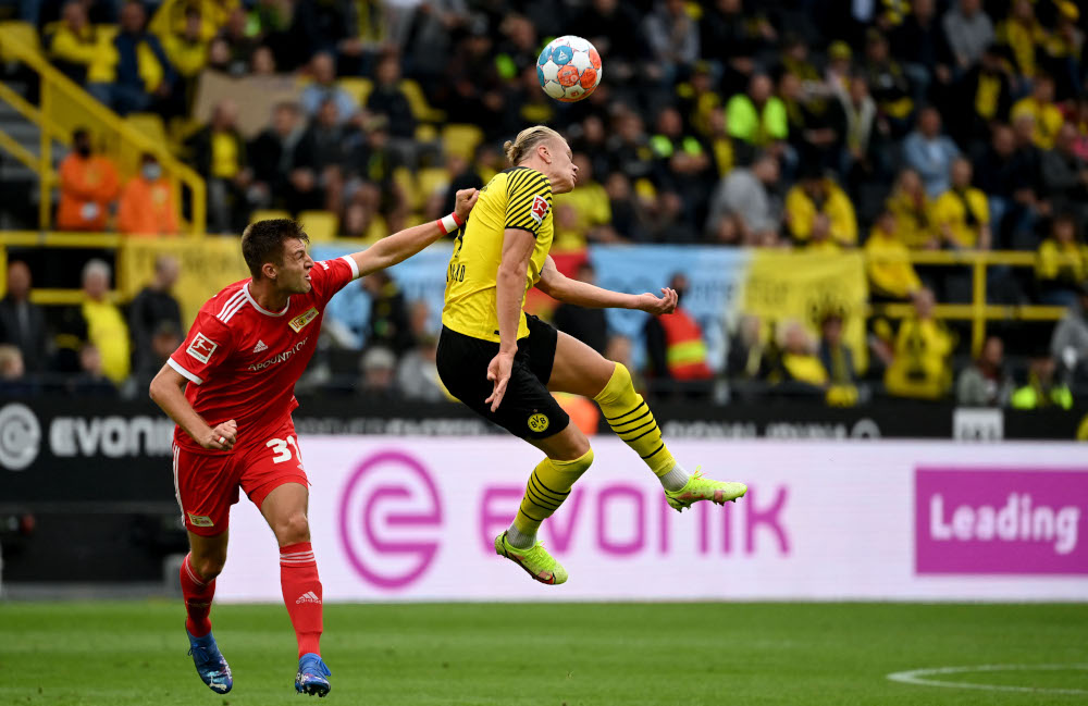 Dortmund forward Erling Braut Haaland and Union Berlin defender Robin Knoche vie for the ball during the German first division Bundesliga football match, September 19, 2021 in Dortmund, western Germany. u00e2u20acu201d AFP picnn