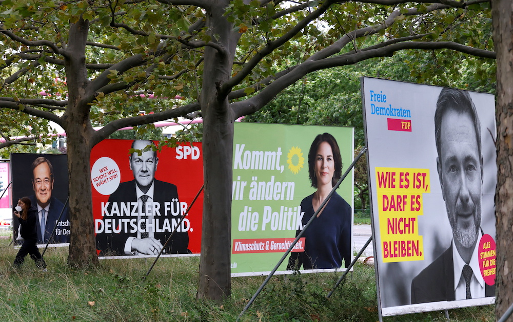 Election posters of Germanyu00e2u20acu2122s top candidates for chancellor, Armin Laschet, Olaf Scholz, Annalena Baerbock, and Christian Lindnerare pictured in Berlin, Germany, September 16, 2021. u00e2u20acu201d Reuters picnnn