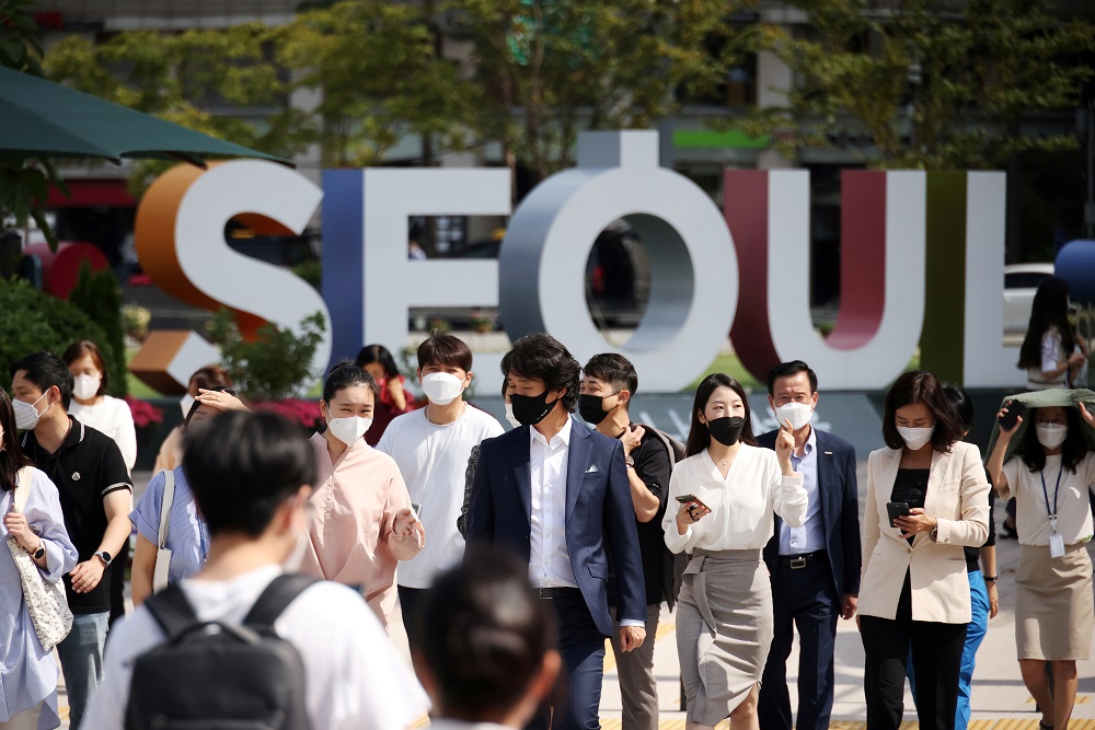 Commuters wear masks to avoid contracting the coronavirus disease, walk on a zebra crossing in Seoul, South Korea September 24, 2021. u00e2u20acu2022 Reuters pic
