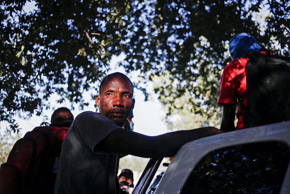 A migrant waits to move to a fixed shelter from a makeshift camp at Braulio Fernandez Ecological Park near the border with the US, in Ciudad Acuna, Mexico, September 24, 2021. u00e2u20acu201d Reuters picnn