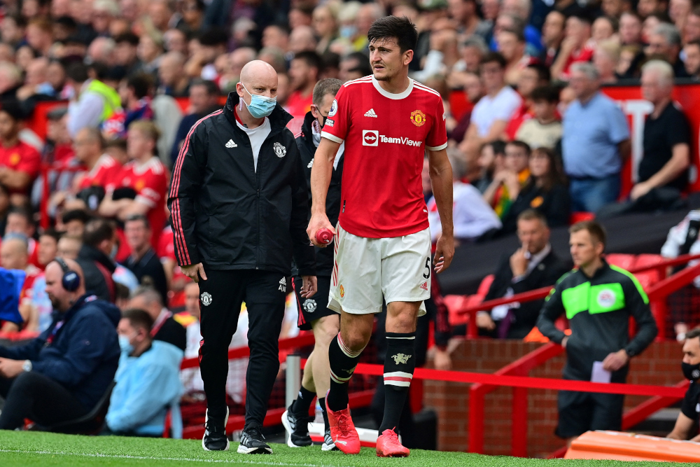 Manchester United defender Harry Maguire leaves the pitch injured during the English Premier League football match against Aston Villa at Old Trafford in Manchester, England, September 25, 2021. u00e2u20acu201d AFP pic 
