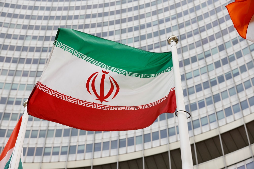 The Iranian flag waves in front of the International Atomic Energy Agency (IAEA) headquarters in Vienna, Austria May 23, 2021. u00e2u20acu2022 Reuters file pic