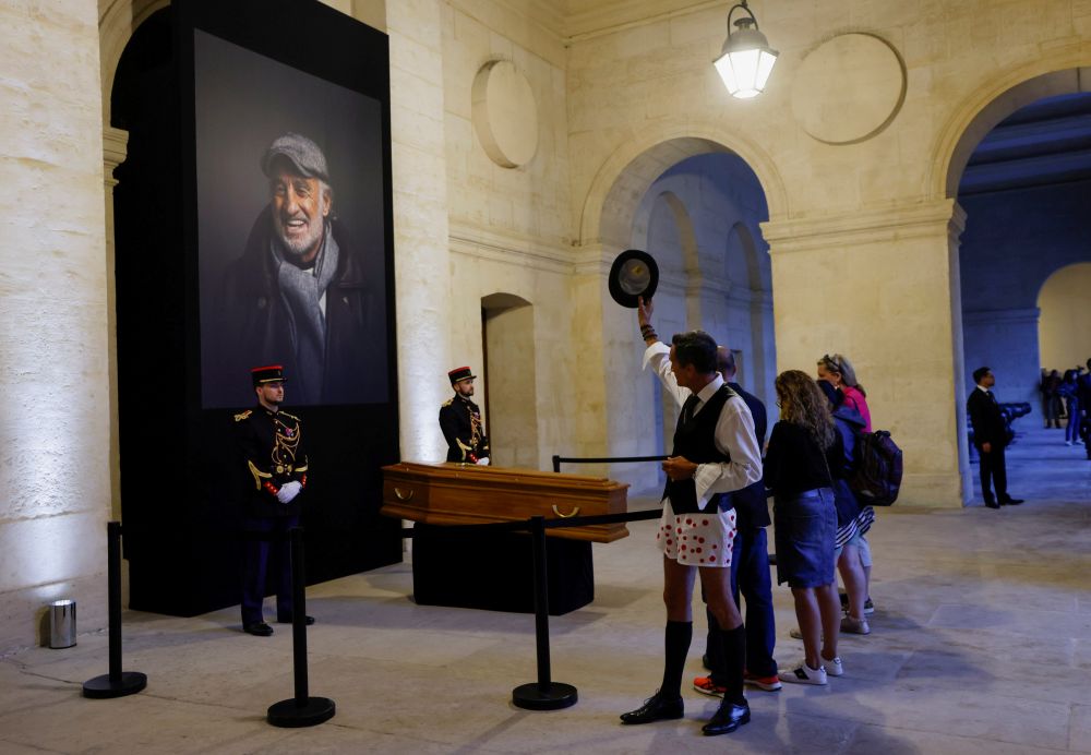 A man waves his hat as he pays his respects to late actor Jean-Paul Belmondo during a national tribute at the Hotel des Invalides in Paris September 9, 2021. u00e2u20acu201d Reuters pic