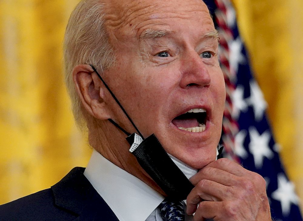 US President Joe Biden removes his face mask as he arrives to deliver remarks in honour of labour unions in the East Room at the White House in Washington, US, September 8, 2021. u00e2u20acu201d Reuters pic