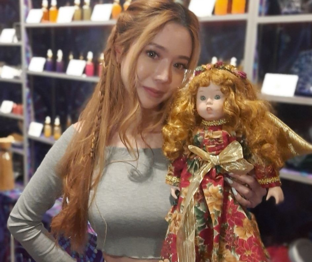 Bambi Leong, a self-proclaimed clairvoyant, has a collection of books of spells and dolls in her shop in Sim Lim Square electronics mall. u00e2u20acu201d Picture via Facebook/BambiNe  