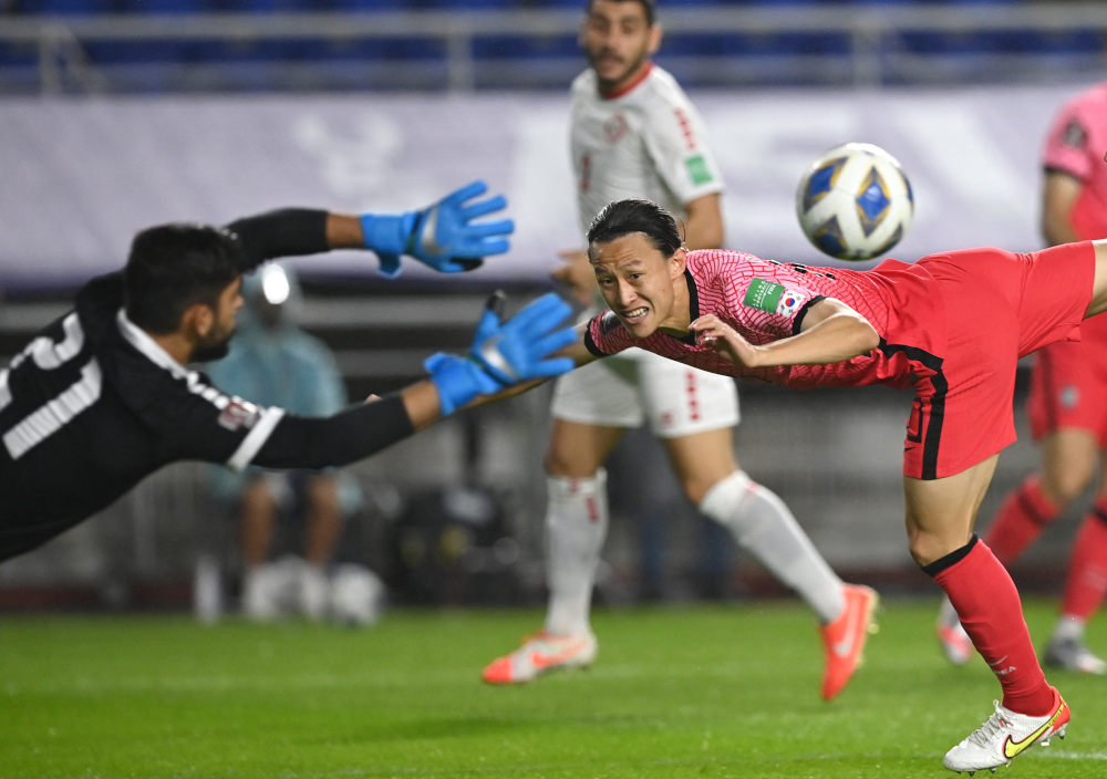 South Koreau00e2u20acu2122s Lee Jae-sung competes for the ball with Lebanonu00e2u20acu2122s goalkeeper Mostafa Matar during the Fifa World Cup Qatar 2022 Asian qualification football match in Suwon, September 7, 2021. u00e2u20acu201d AFP picnn