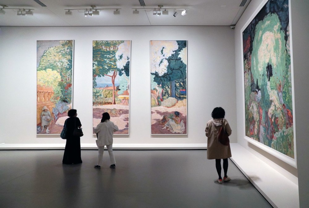 Visitors look at paintings by French painter Pierre Bonnard during a press visit of the exhibition u00e2u20acu02dcThe Morozov Collection u00e2u20acu201d Modern art icons at the Fondation Louis Vuitton in Paris on September 15, 2021. u00e2u20acu201d AFP picnn