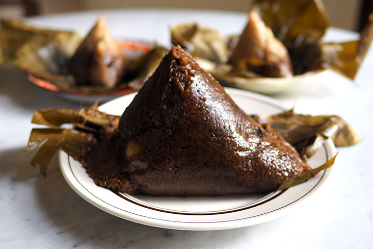 You get an assortment of rice dumplings here but their specialty is this dark Hainan rice dumpling which is huge
