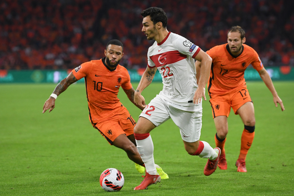 Turkeyu00e2u20acu2122s defender Kaan Ayhan fights for the ball with Netherlandsu00e2u20acu2122 forward Memphis Depay and defender Daley Blind during the Fifa World Cup Qatar 2022 qualifying round Group G match at the Johan Cruijff Arena stadium in Amsterdam, September 7, 2021. u00e2
