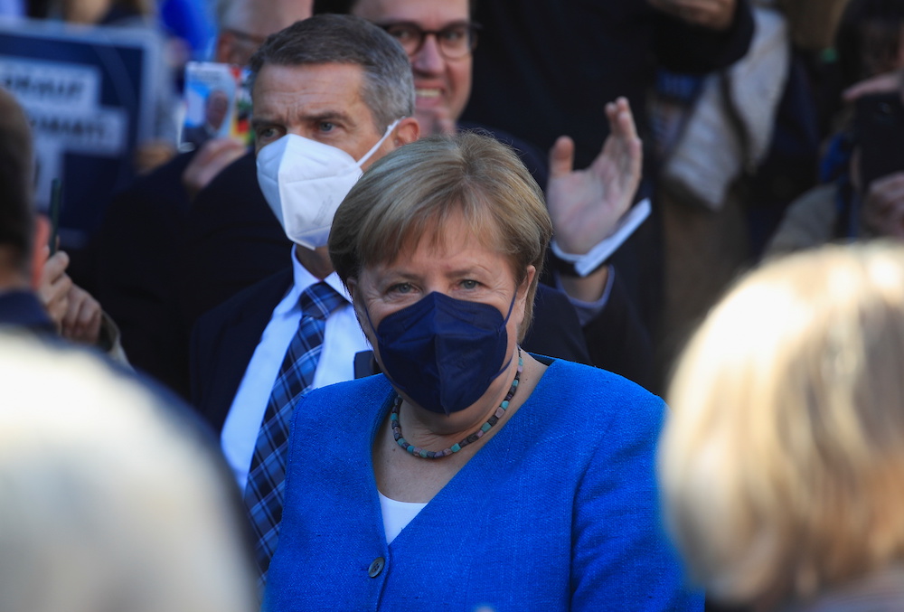 German Chancellor Angela Merkel together with North Rhine-Westphalia State Premier, Christian Democratic Union party leader and candidate for chancellor Armin Laschet, attends a rally ahead of the September 26 general election, in Aachen, Germany, Septemb