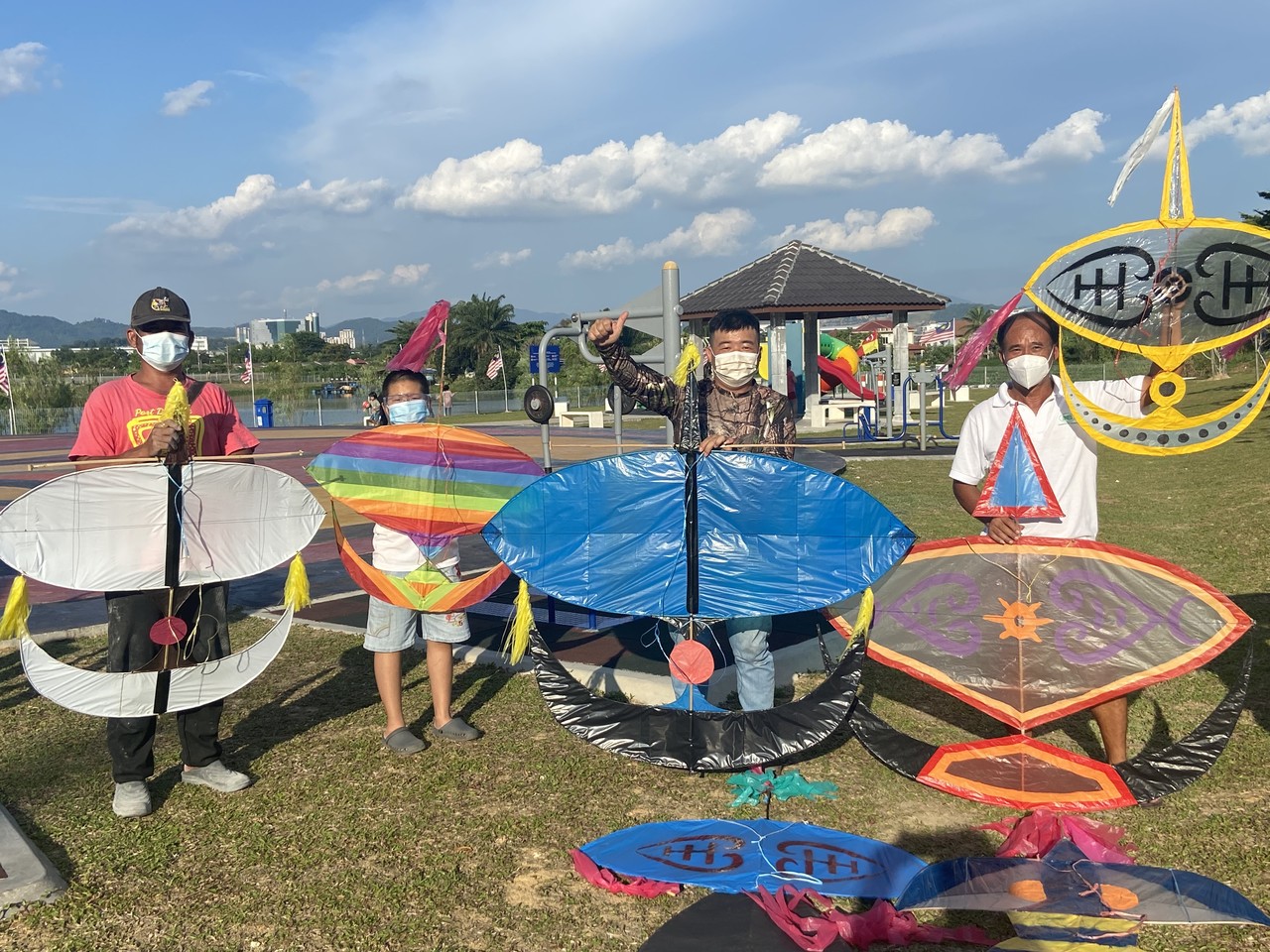 Tan Chin Seong, 36, (second right) with other Chinese friends made the traditional kite game popular among the Malays as a hobby while doing recreational activities almost every evening at Sungai Chua Recreational Park, Kajang, Selangor, September 26, 202