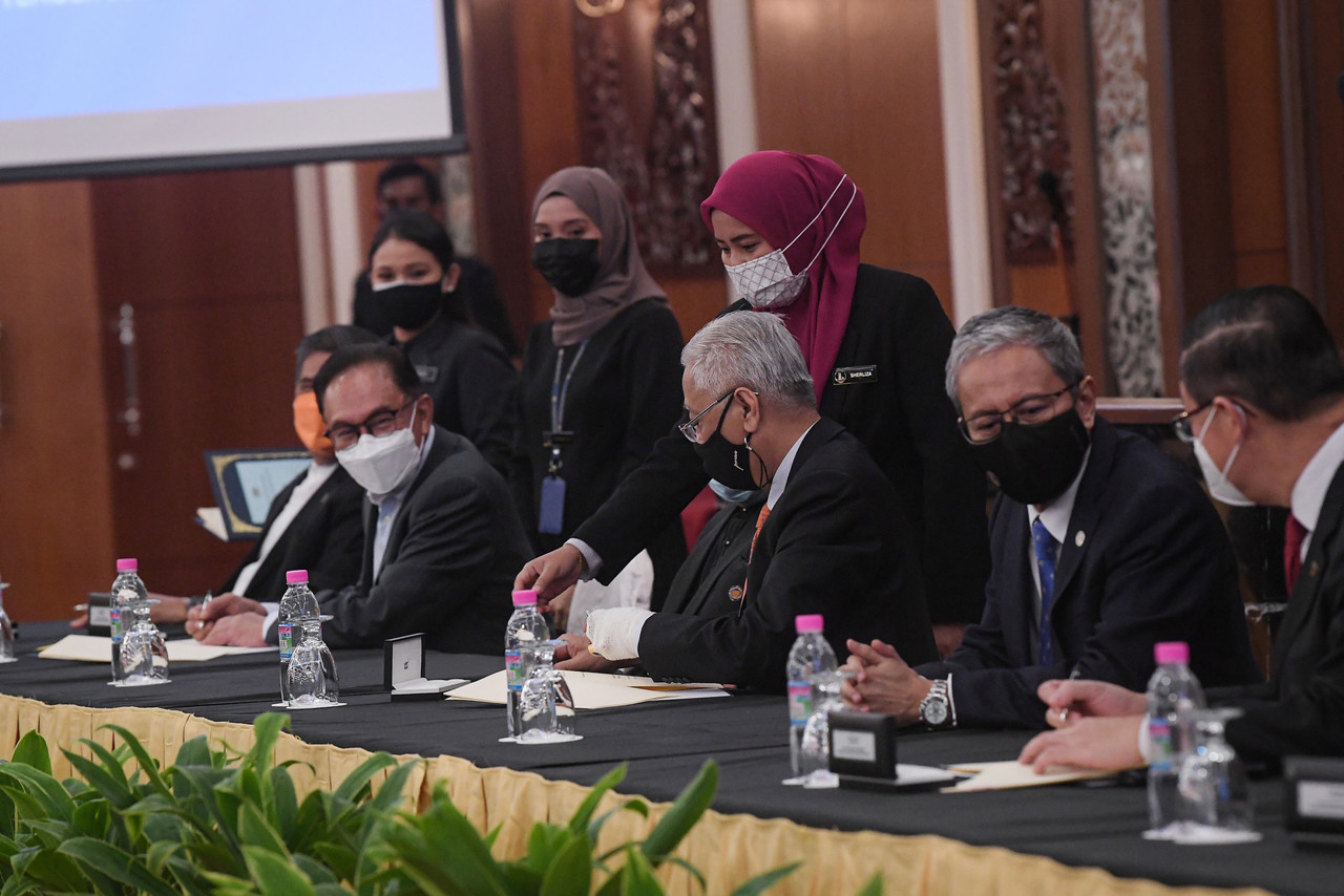 Prime Minister Datuk Seri Ismail Sabri Yaakob (centre) attending the signing ceremony of the Memorandum of Understanding on Transformation and Political Stability Between the Federal Government and Pakatan Harapan at Parliament House, September 13, 2021. 