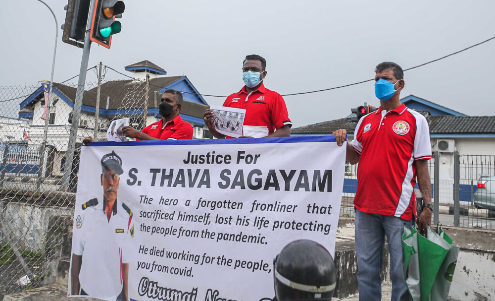 Representatives from non-governmental organisations (NGO) Persatuan MIAForce, Persatuan Pemas, Persatuan F.I.R.E and Ottrumai Naam Balam Youth near the Ipoh police district headquarters, September 7, 2021. u00e2u20acu201d Picture by Farhan Najib