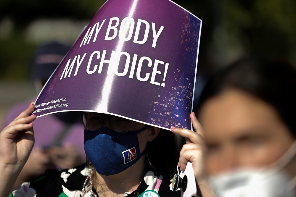 A demonstrator holds a pro-abortion rights sign as she listens to speakers at a Black Women Take Action event outside the US Supreme Court building in Washington September 15, 2021. u00e2u20acu2022 Reuters pic