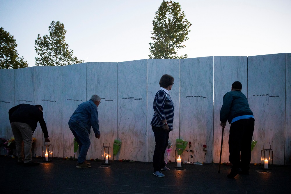 People place lanterns at the Wall of Names during the Luminaria Ceremony to serve as tribute to the passengers and crew members of Flight 93 in Stoystown, Pennsylvania September 10, 2021. u00e2u20acu2022 Reuters pic