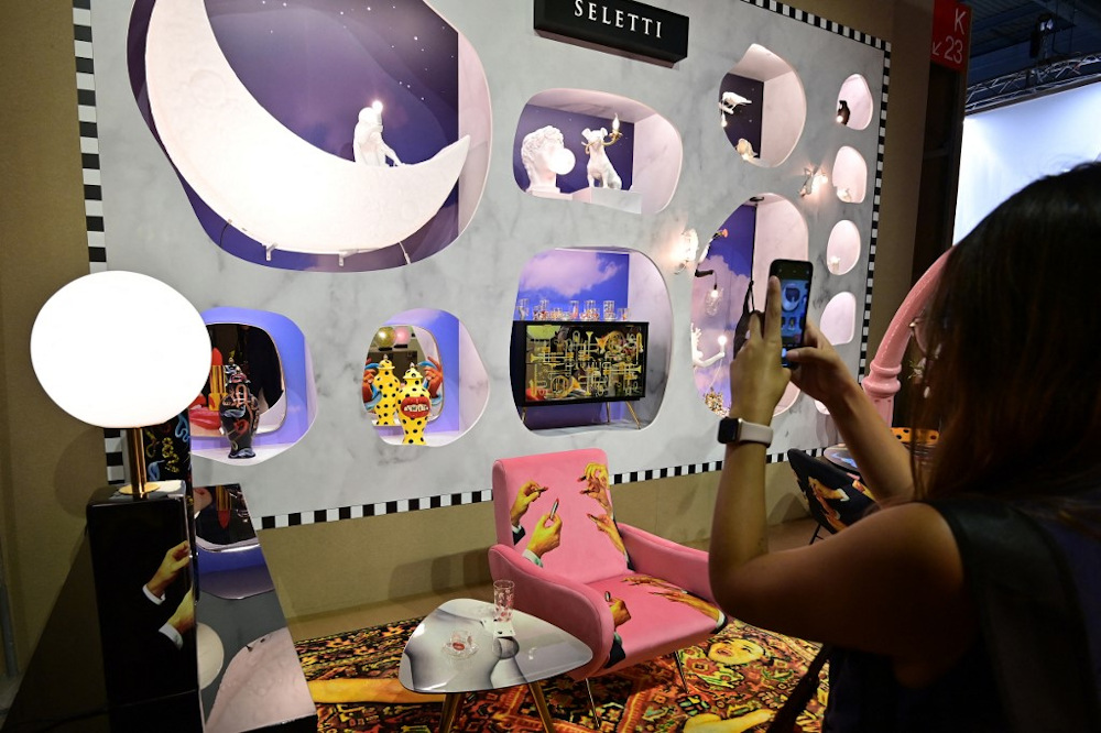 A visitor takes pictures of the Seletti stand, at the u00e2u20acu02dcSuper Saloneu00e2u20acu2122, one of the special events of the 2021 Salone del Mobile Milano, an International Furnishing and Design Fair, taking place at the Fiera Milano venue September 7, 2021. u00e2u20acu201d AFP pic