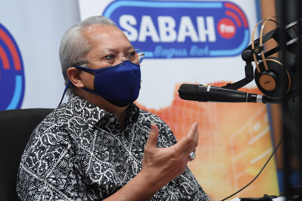 Communications and Multimedia Minister Tan Sri Annuar Musa answers a radio calleru00e2u20acu2122s question at the Ministry of Communications and Multimediau00e2u20acu2122s Integrated Complex in Kota Kinabalu, September 16, 2021. u00e2u20acu201d Bernama pic 