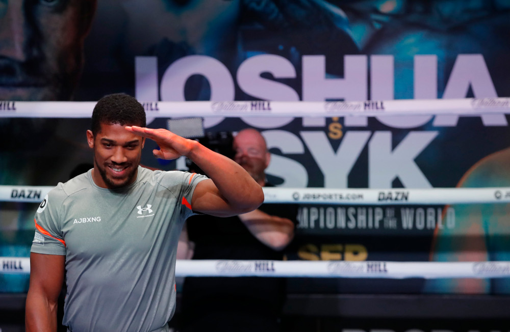 Anthony Joshua acknowledges the fans during his public workout at Indigo at The O2, London, September 21, 2021. u00e2u20acu201d Action Images via Reuters