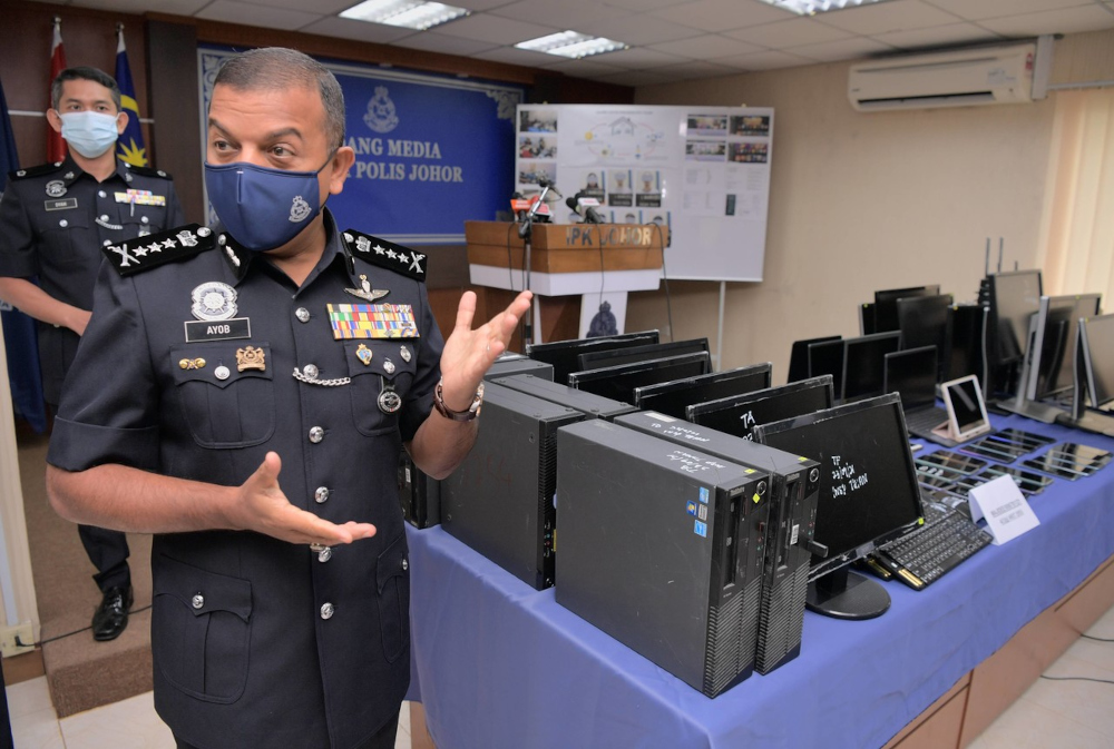 Johor police chief Datuk Ayob Khan Mydin Pitchay with the seized items during a media conference held at the Johor police contingent headquarters, September 27, 2021. u00e2u20acu201d Bernama pic 