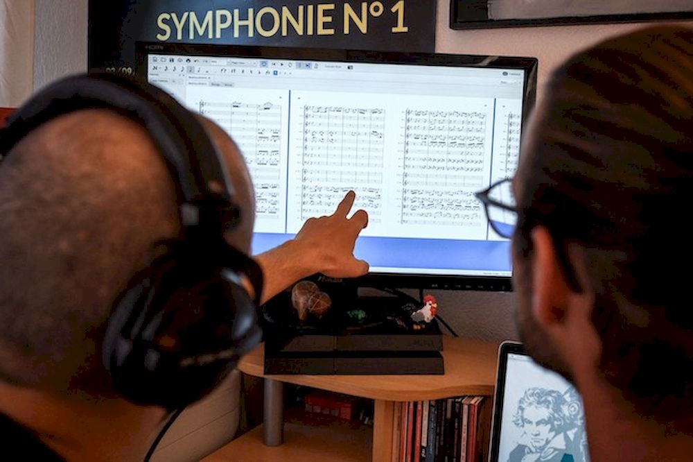 Computer programme designer Florian Colombo (right) and conductor Guillaume Berney. u00e2u20acu201d AFP pic