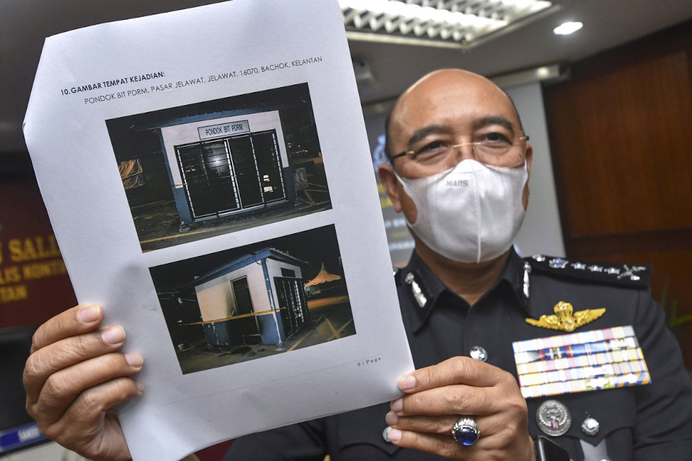 Kelantan police chief Datuk Shafien Mamat shows a picture of police beat base that caught fire in Bachok September 12, 2021. u00e2u20acu201d Bernama pic