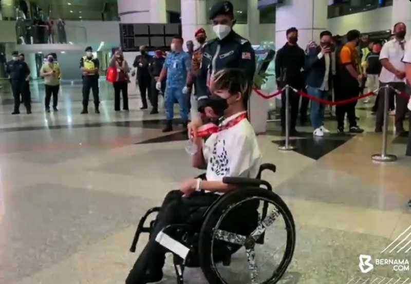 Tokyo Paralympics boccia silver medallist Chew Wei Lun poses for a picture after his arrival at KLIA September 3, 2021. u00e2u20acu201d Video screencap via Twitter/Bernama