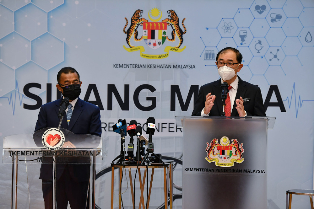 Deputy Education Minister Datuk Dr Mah Hang Soon (right) speaks during a joint press conference with Deputy Health Minister Datuk Dr Noor Azmi Ghazali (left) in Putrajaya September 22, 2021. u00e2u20acu201d Bernama pic