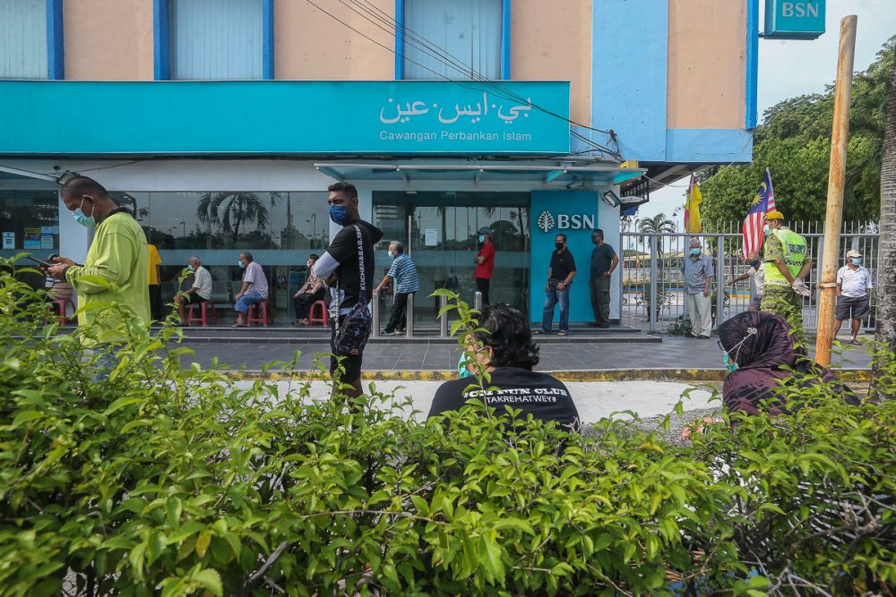 People queue in front of a Bank Simpanan Nasional branch in Klang September 6, 2021. u00e2u20acu201d Picture by Yusof Mat Isa