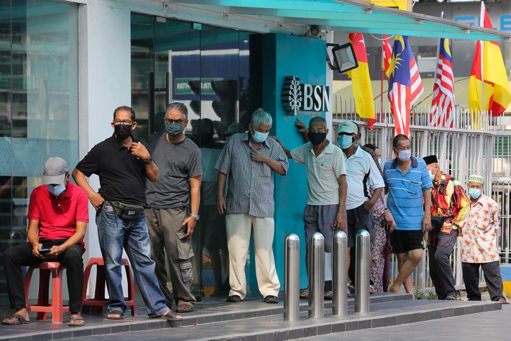 People queue in front of a Bank Simpanan Nasional branch in Klang September 6, 2021. u00e2u20acu201d Picture by Yusof Mat Isa