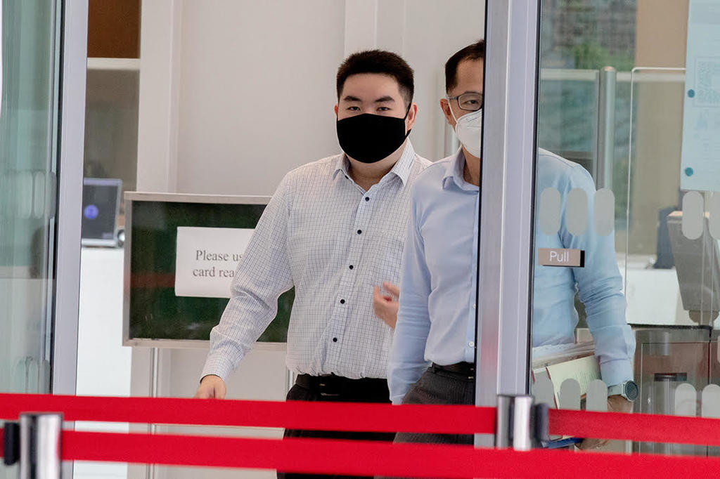 Colin Chua Yi Jin (left), 23, leaving the State Courts on July 29, 2021. u00e2u20acu2022 TODAY pic