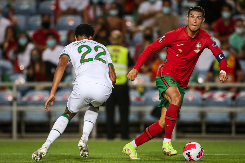 Portugalu00e2u20acu2122s Cristiano Ronaldo fights for the ball with Republic of Irelandu00e2u20acu2122s defender Andrew Omobamidele during the Fifa World Cup Qatar 2022 European qualifying round group A match at the Algarve stadium in Loule, Portugal, September 1, 2021. u00e2u20acu201d AFP 