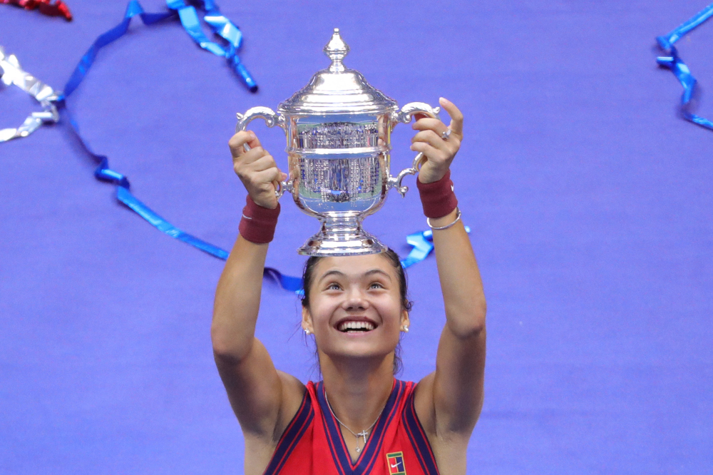 Britainu00e2u20acu2122s Emma Raducanu celebrates with the trophy after winning the 2021 US Open Tennis tournament womenu00e2u20acu2122s final match against Canadau00e2u20acu2122s Leylah Fernandez at the USTA Billie Jean King National Tennis Center in New York, September 11, 2021. u00e2u20acu201d AFP pi