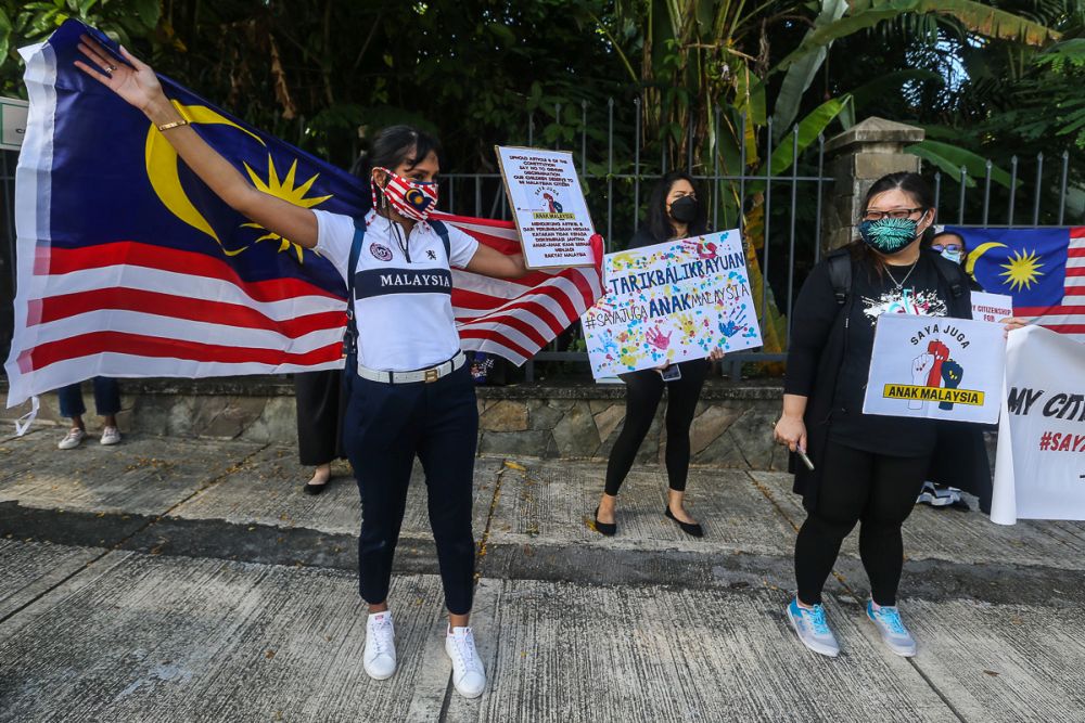 Members of Family Frontiers hold up placards demanding equal citizenship rights for Malaysians outside the Parliament building in Kuala Lumpur September 23, 2021. u00e2u20acu201d Picture by Yusof Mat Isa