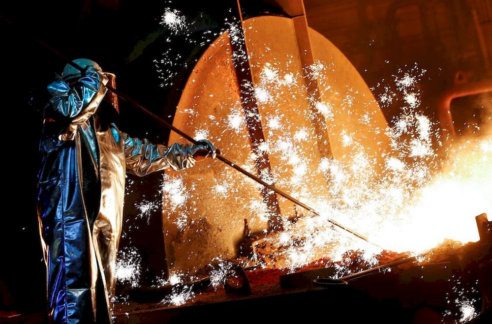A steel worker of Germanyu00e2u20acu2122s industrial conglomerate ThyssenKrupp AG, stands amid sparks of raw iron from a blast furnace at Germanyu00e2u20acu2122s largest steel factory in Duisburg, Germany, January 28, 2019. u00e2u20acu201d Reuters pic