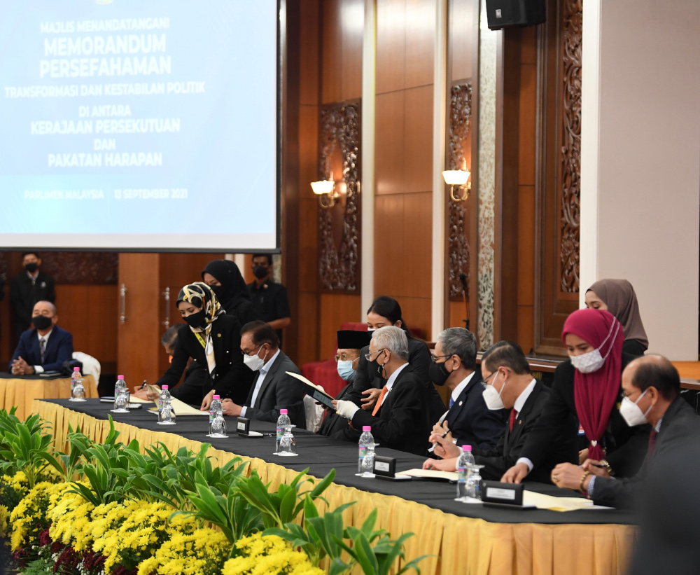 Those present for the official signing were PKR president Datuk Seri Anwar Ibrahim, DAP secretary-general Lim Guan Eng, Parti Amanah Negara president Mohamad Sabu and United Progressive Kinabalu Organisation president Datuk Seri Wilfred Madius Tangau. — Picture courtesy of Prime Minister's Office