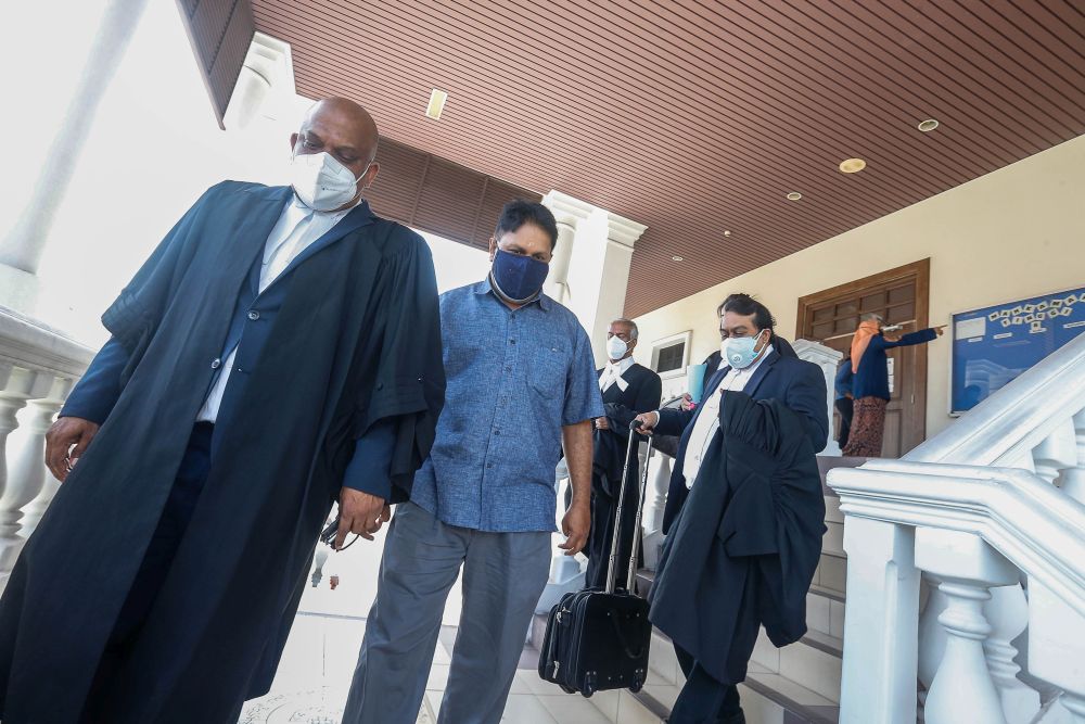 Former Penang city councillor L. Prem Anand (centre) is pictured at the Penang High Court September 30, 2021. u00e2u20acu201d Picture by Sayuti Zainudin