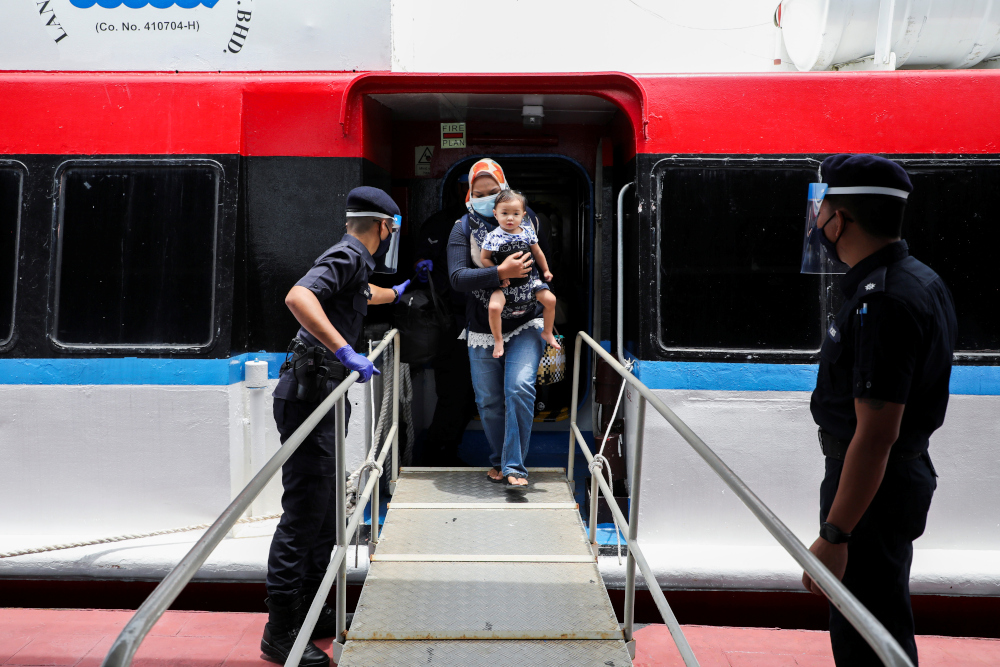 Tourists arrive at the jetty, as Langkawi reopens to domestic tourists, amid the coronavirus disease (Covid-19) pandemic, in Malaysia September 16, 2021. u00e2u20acu201d Reuters pic 
