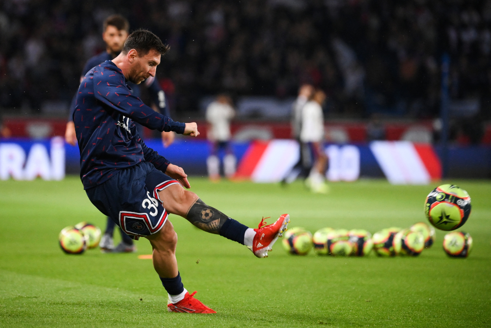 Paris Saint-Germain forward Lionel Messi shoots the ball during warm-up before the French L1 football match between PSG and Olympique Lyonnais at The Parc des Princes Stadium in Paris, September 19, 2021. u00e2u20acu201d AFP pic 