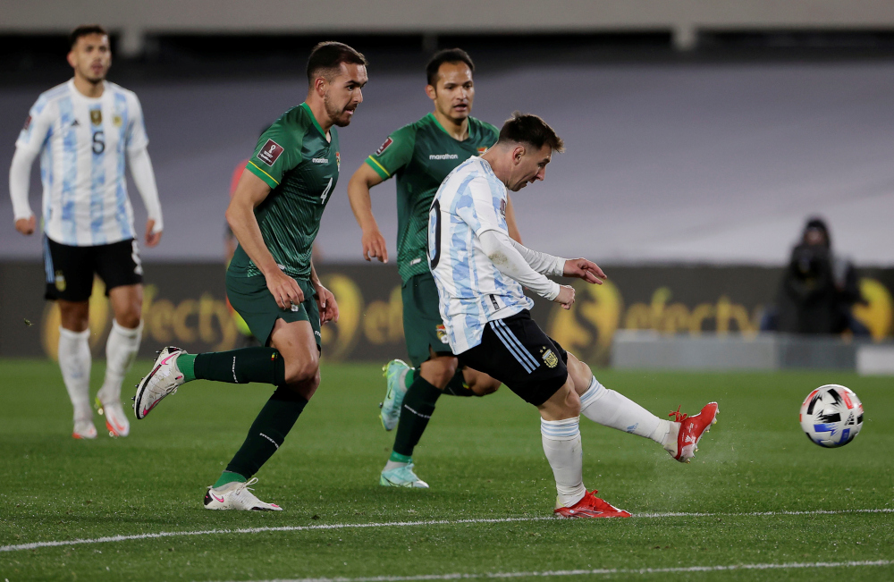 Argentinau00e2u20acu2122s Lionel Messi scores their first goal during the World Cup South American qualifiers against Bolivia at El Monumental, Buenos Aires, September 9, 2021. u00e2u20acu201d Reuters pic 
