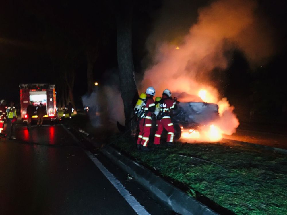 nFirefighters work to put out the raging car fire. u00e2u20acu201d Picture via the Fire Deptn