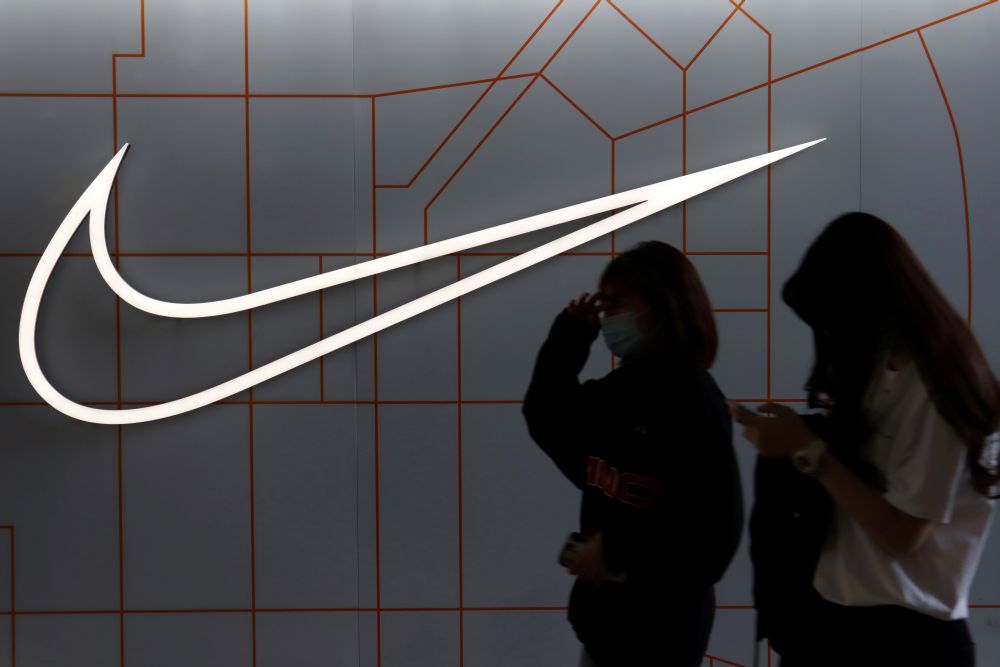 People walk past a store of the sporting goods retailer Nike Inc at a shopping complex in Beijing March 25, 2021. u00e2u20acu201d Reuters pic