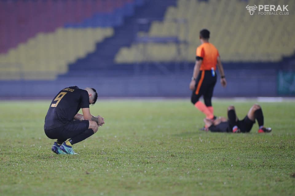 Perak FC players react after their 2-1 loss to Melaka on Friday. u00e2u20acu201d Bernama pic