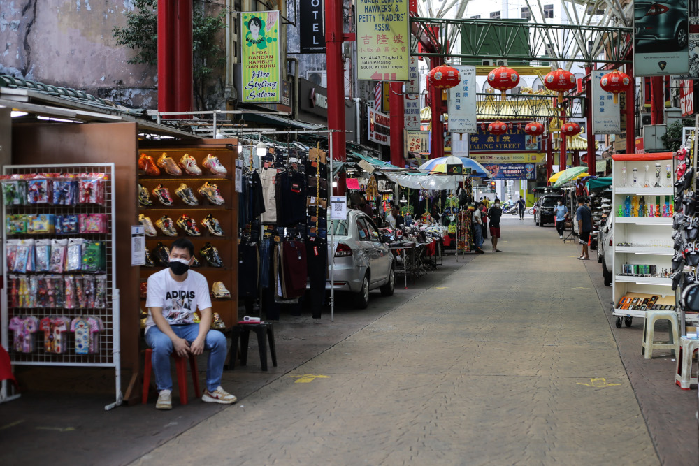 Traders in Petaling Street gradually open for business despite lack of customers amid the Covid-19 pandemic, September 20, 2021. u00e2u20acu201d Picture by Ahmad Zamzahuri