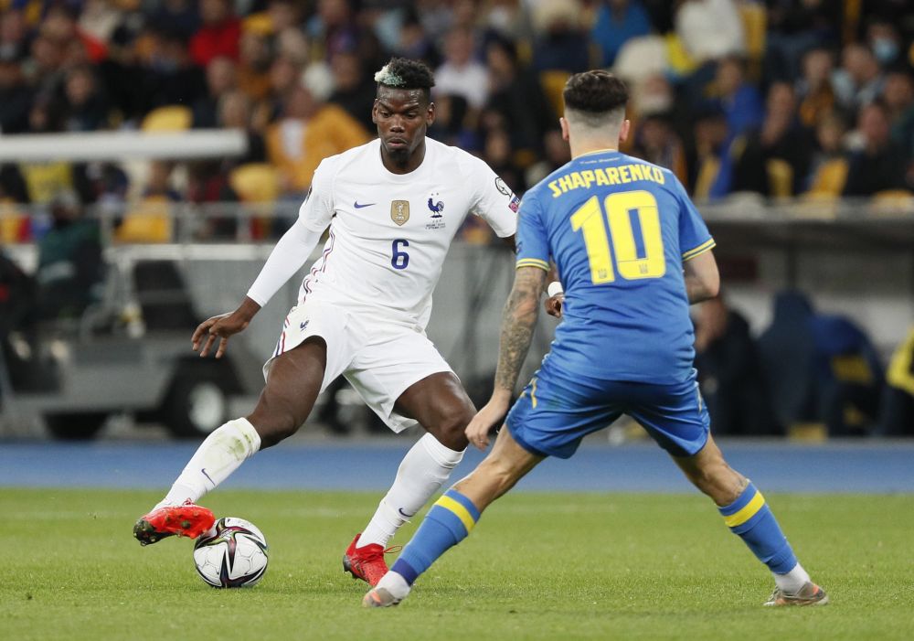 France's Paul Pogba in action with Ukraine's Mykola Shaparenko at NSC Olympiyskiy, Kyiv September 4, 2021. u00e2u20acu201d Reuters pic