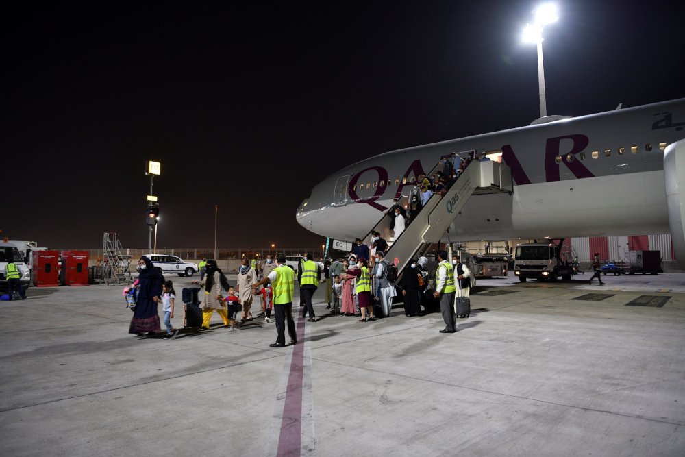 Passengers disembark a Qatar Airways plane arriving from Kabul, Afghanistan, the first international commercial flight since the US withdrawal from Afghanistan, in Doha September 9, 2021. u00e2u20acu201d Reuters pic