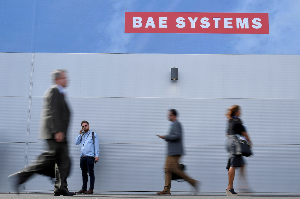 Trade visitors walk past an advertisement for BAE Systems at Farnborough International Airshow in Farnborough July 17, 2018. u00e2u20acu201d Reuters pic