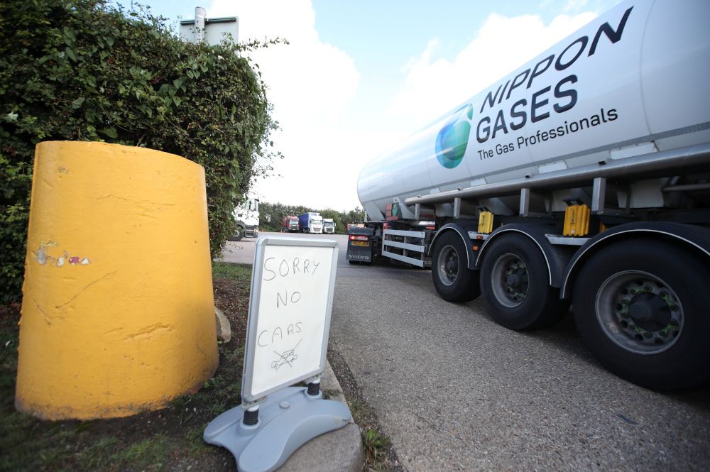 A u00e2u20acu02dcno carsu00e2u20acu2122 sign is seen as lorries queue to enter the Watling Street truck stop amid the fuel shortage in Flamstead, St Albans September 29, 2021. u00e2u20acu201d Reuters pic
