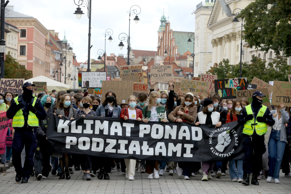 People participate in the Global Climate Strike of the movement Fridays for Future in Warsaw September 24, 2021. The banner reads u00e2u20acu02dcClimate beyond divisionsu00e2u20acu2122. u00e2u20acu201d Reuters pic